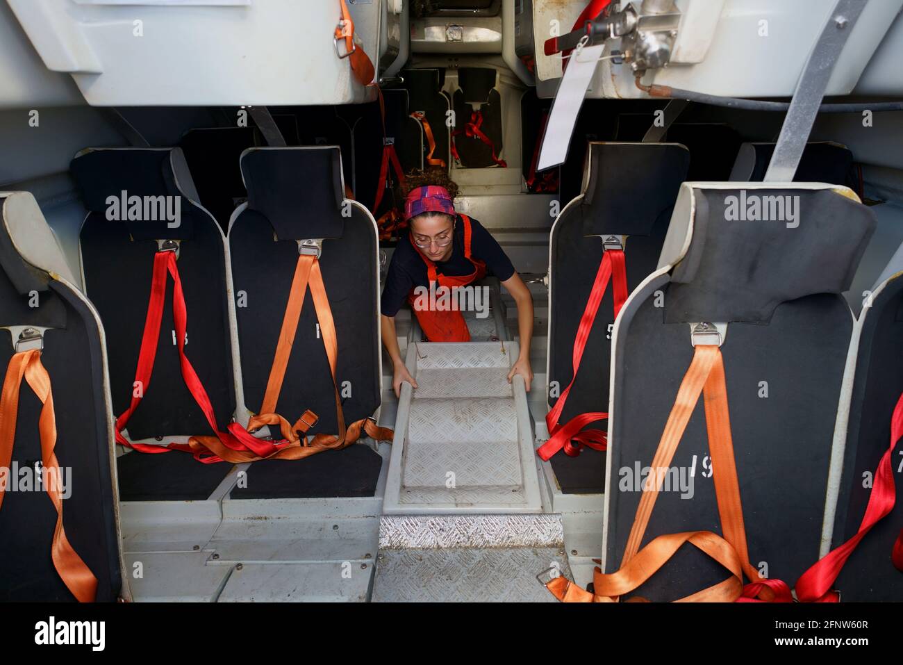woman deck officer during life boat maintenance Stock Photo Alamy