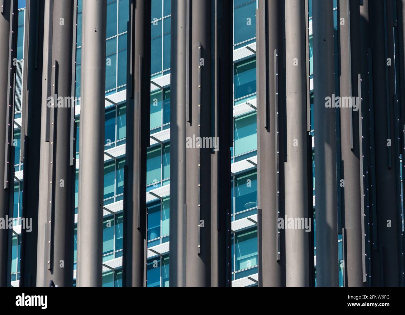 An abstract view of a skyscraper as seen through the iconic columns of ...