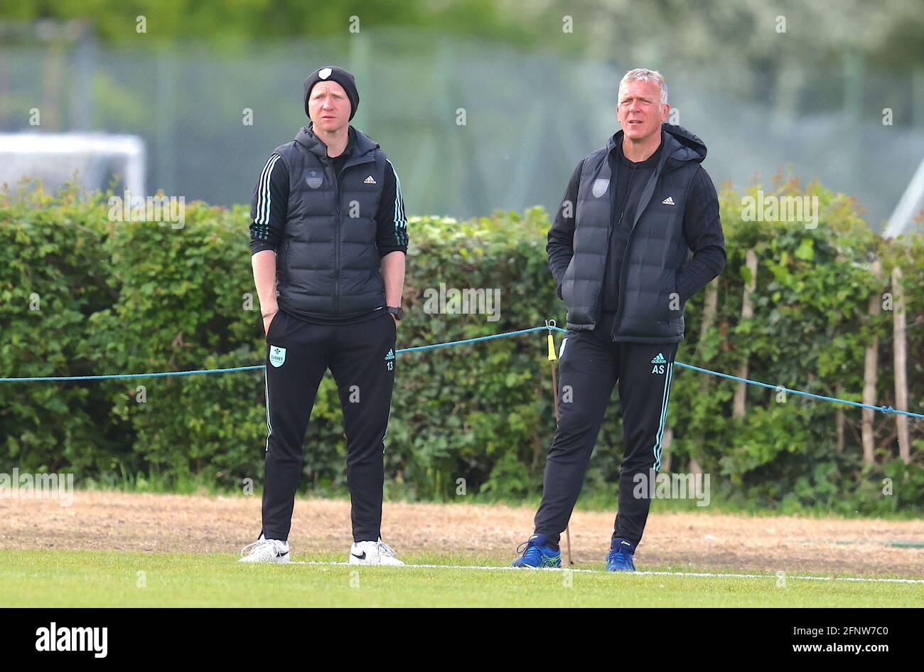 Gareth Batty and Alex Stewart watching as Surrey take on Hampshire in the 2nd XI match at New Malden, day two. David Rowe/Alamy Live News Stock Photo