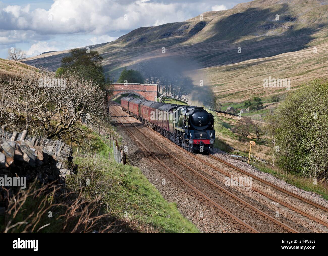Steam locomotive 'British India Line' steaming south near Ais Gill in the Yorkshire Dales National Park on the Settle-Carlisle railway line. Stock Photo