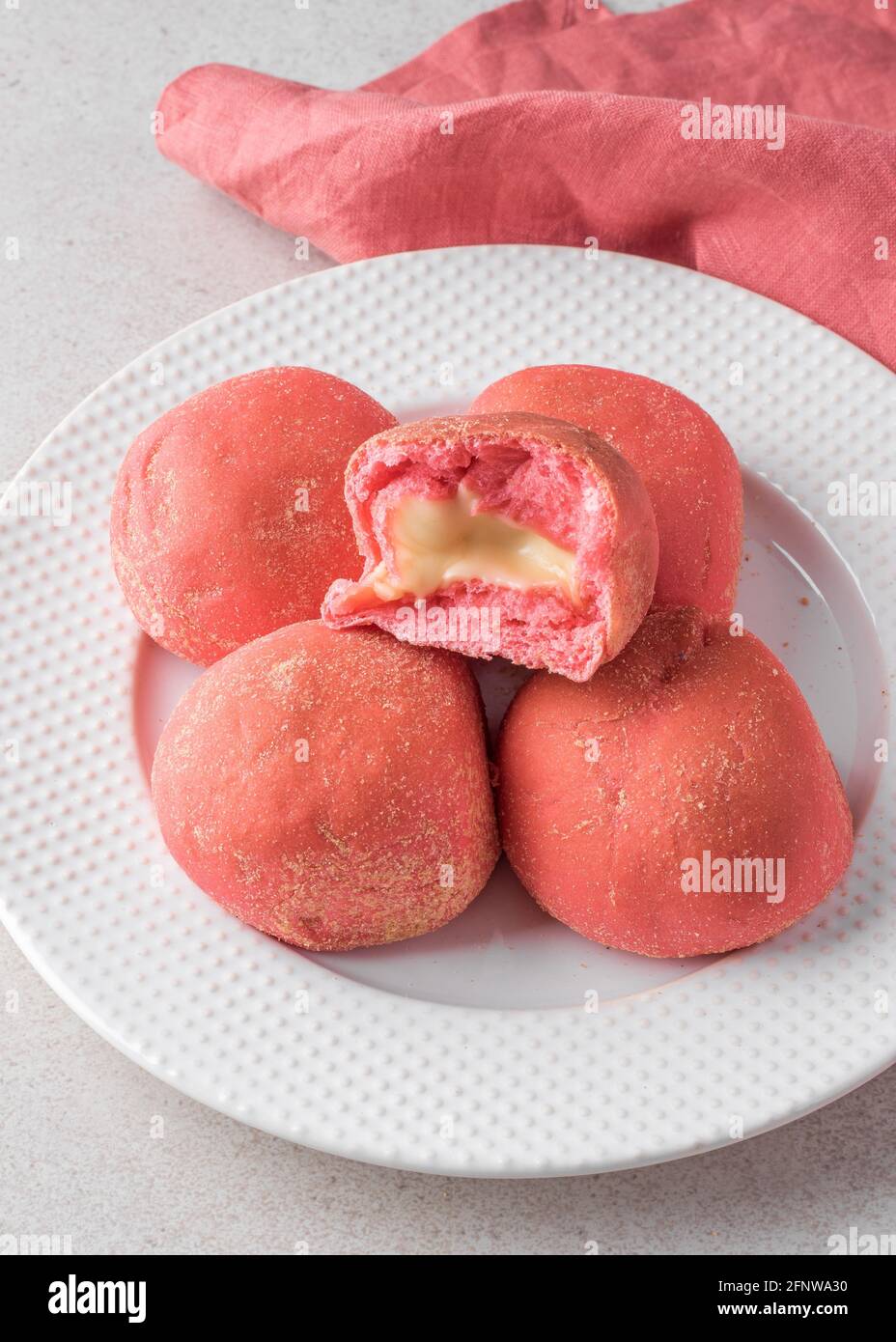 Pink strawberry bread pandesal with cheese filling Stock Photo