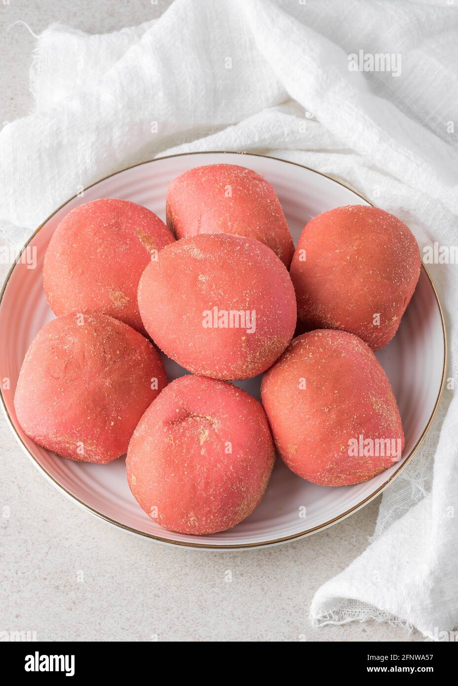 Pink strawberry bread pandesal with cheese filling Stock Photo