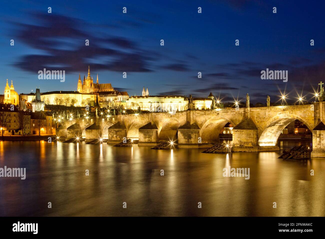 Prague, Czechia. Hradcany castle and Charles bridge at dusk. Stock Photo