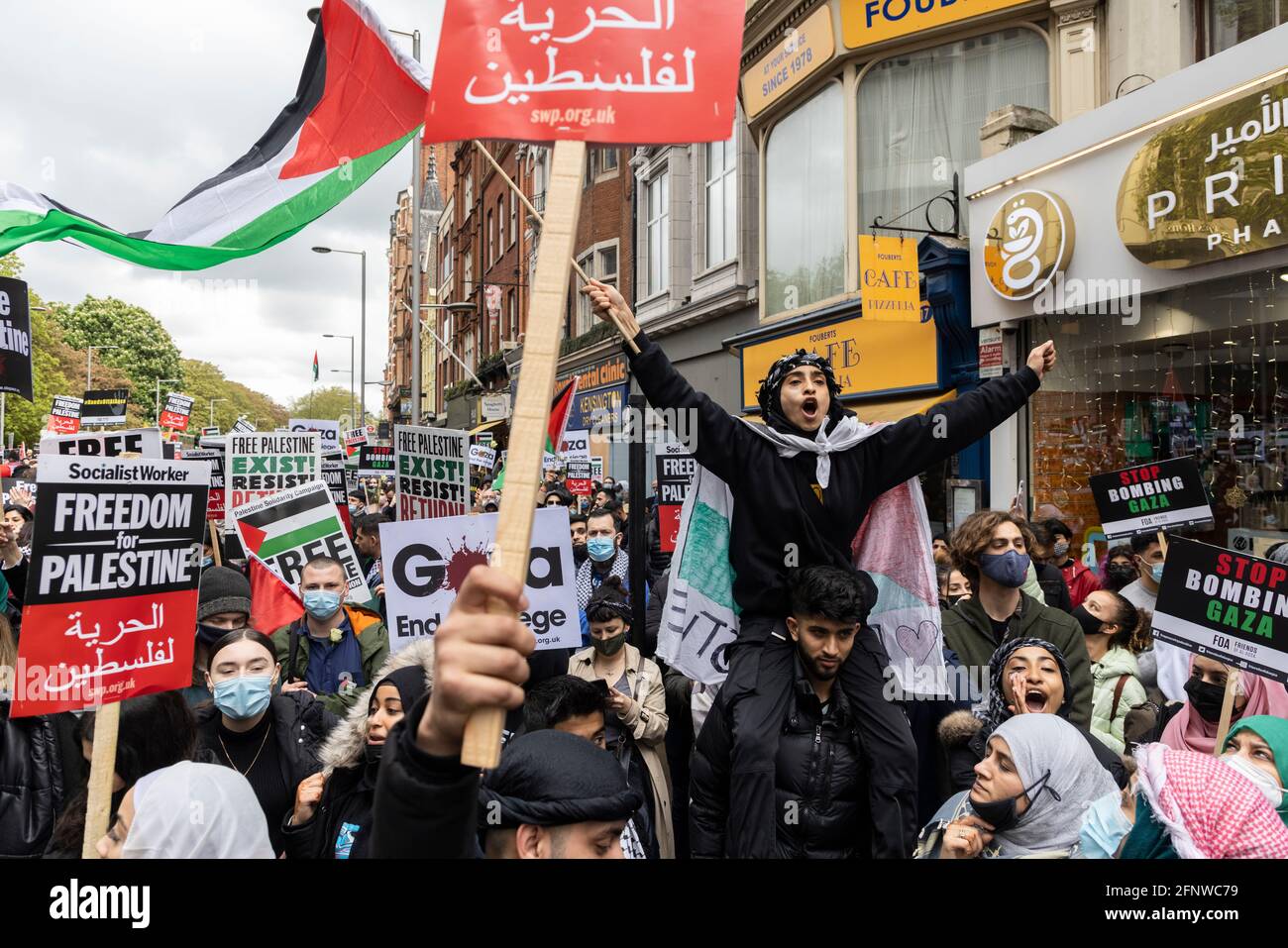 A protester with arms outstretched shouting, 'Free Palestine' solidarity protest, London, 15 May 2021 Stock Photo
