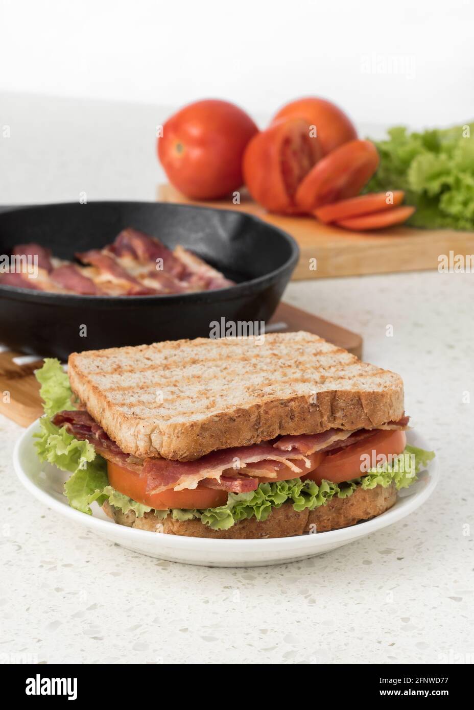 Grilled BLT Sandwich with bacon, tomato, lettuce, and whole wheat bread Stock Photo