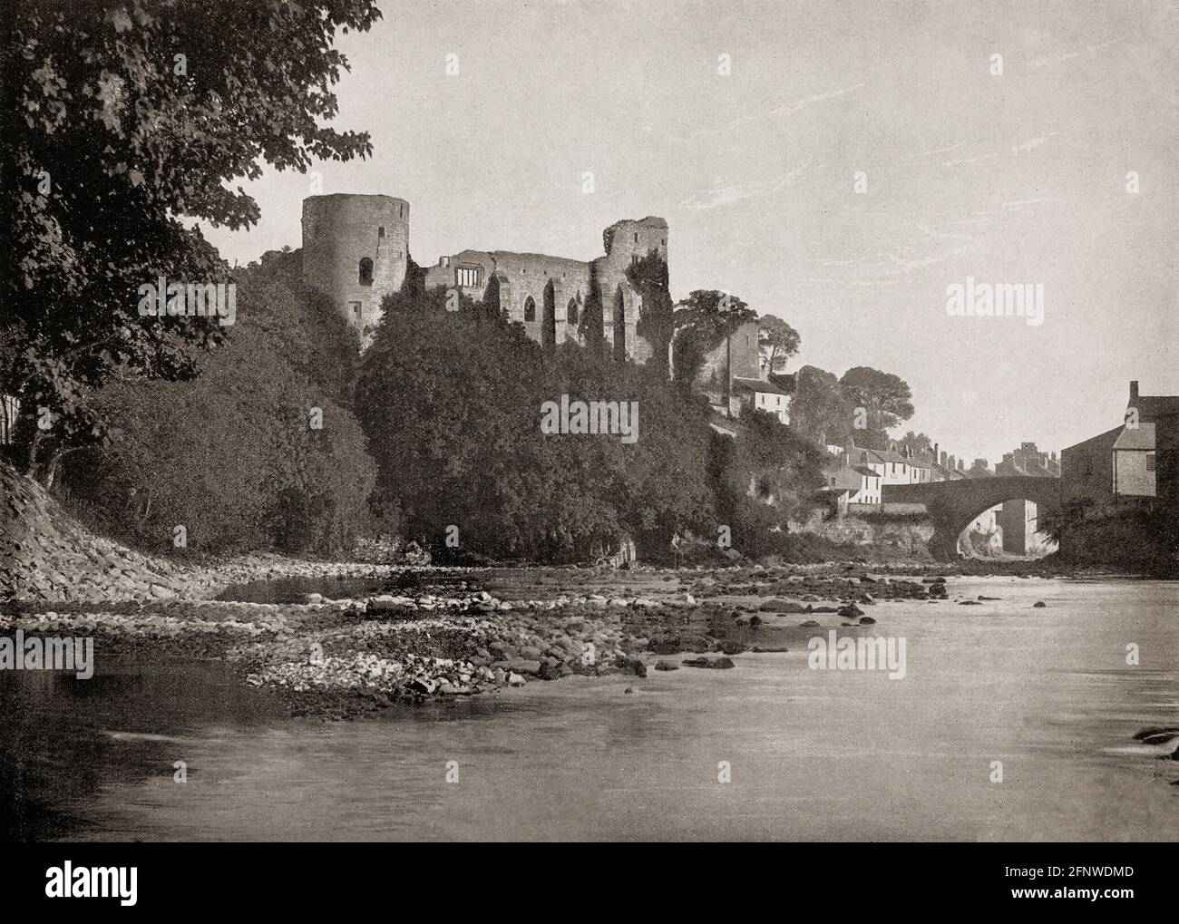 A late 19th Century view of Barnard Castle, a market town in Teesdale, County Durham, England. It is named after the castle around which it was built and sits on the River Tees. The castle was  built in stone by Bernard de Balliol I during the latter half of the 12th century, giving rise to the town's name. The castle passed down through the Balliol family, then into the possession of Richard Neville, Earl of Warwick. King Richard III inherited it through his wife, Anne Neville, but it fell into ruins in the 15th century after his death. Stock Photo