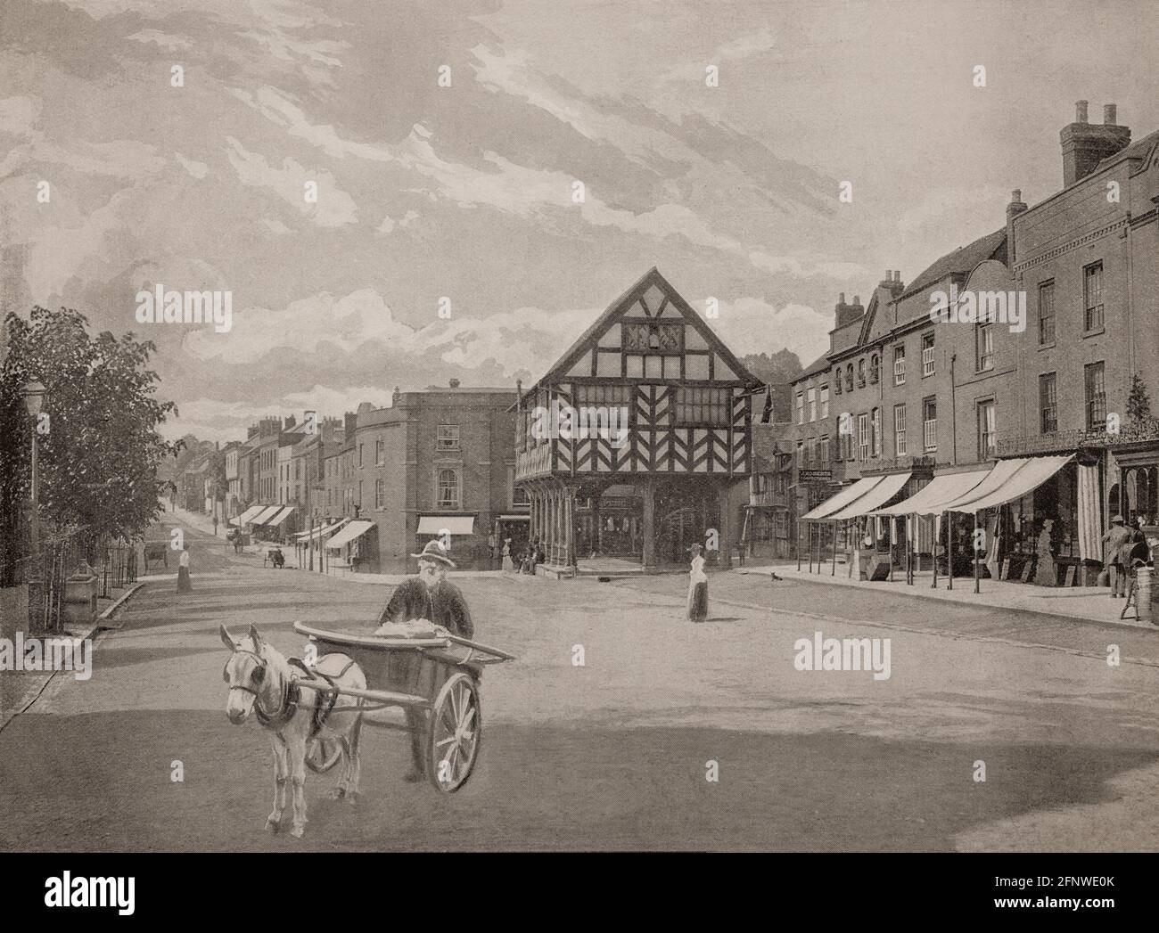 A late 19th Century view of the old Market House dating from 1617 and the Market Place in Ledbury,  a market town in the county of Herefordshire, England. It was home to poet Elizabeth Barrett Browning, who spent her childhood at Hope End, and also the birthplace of poet laureate John Masefield. Stock Photo