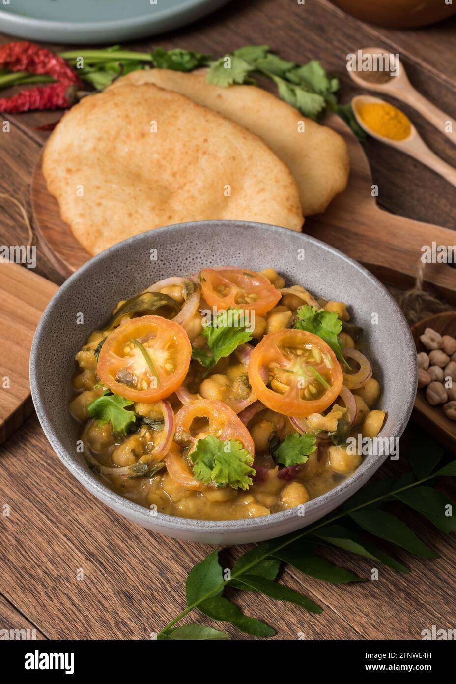 Indian punjabi chole chickpea curry with plain butter naan Stock Photo