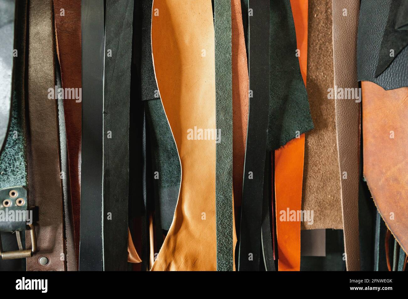 hanging genuine leather straps of various colors Stock Photo - Alamy