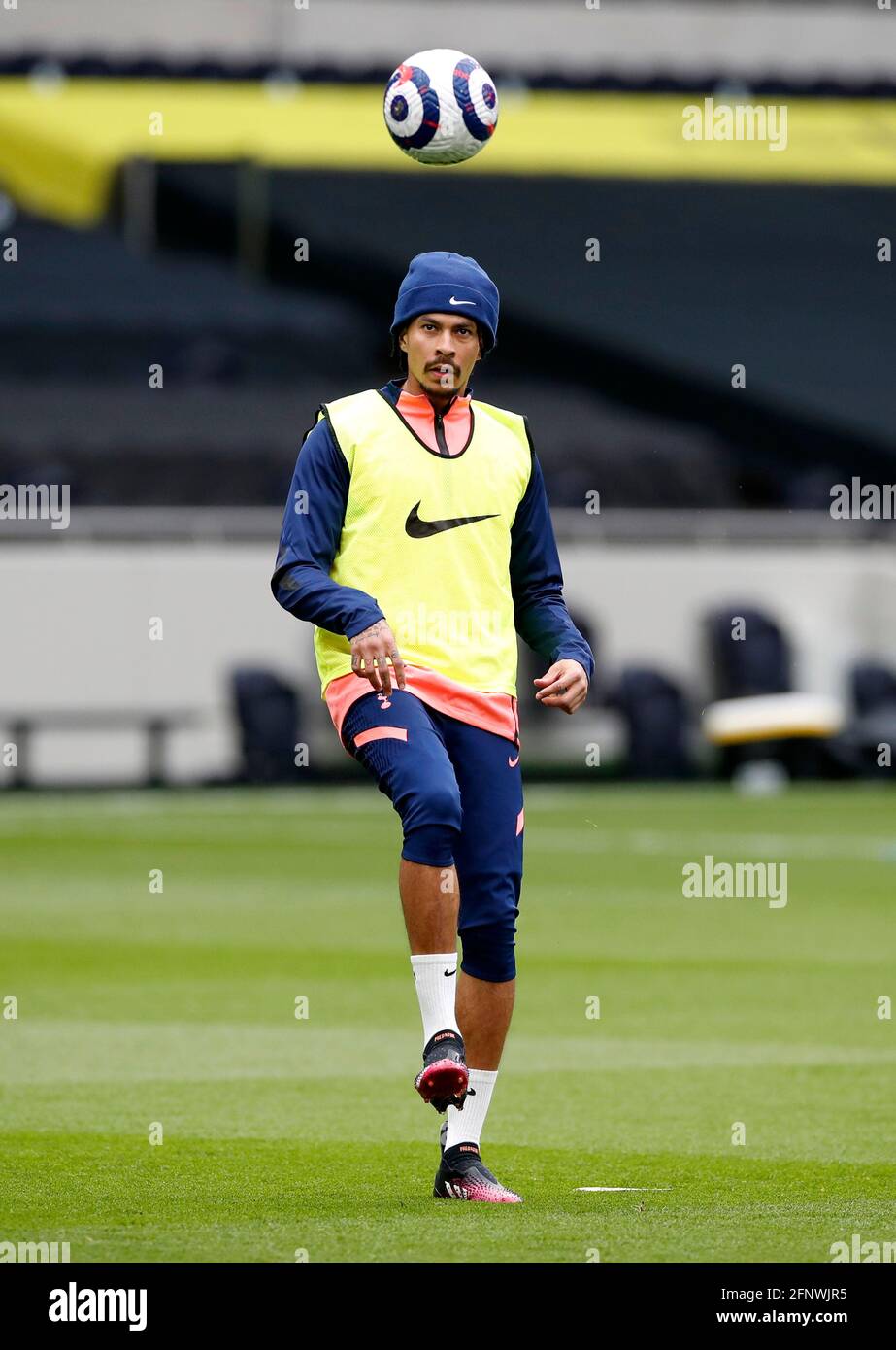 Tottenham Hotspur's Dele Alli warming up before the Premier League match at the Tottenham Hotspur Stadium, London. Picture date: Wednesday May 19, 2021. Stock Photo