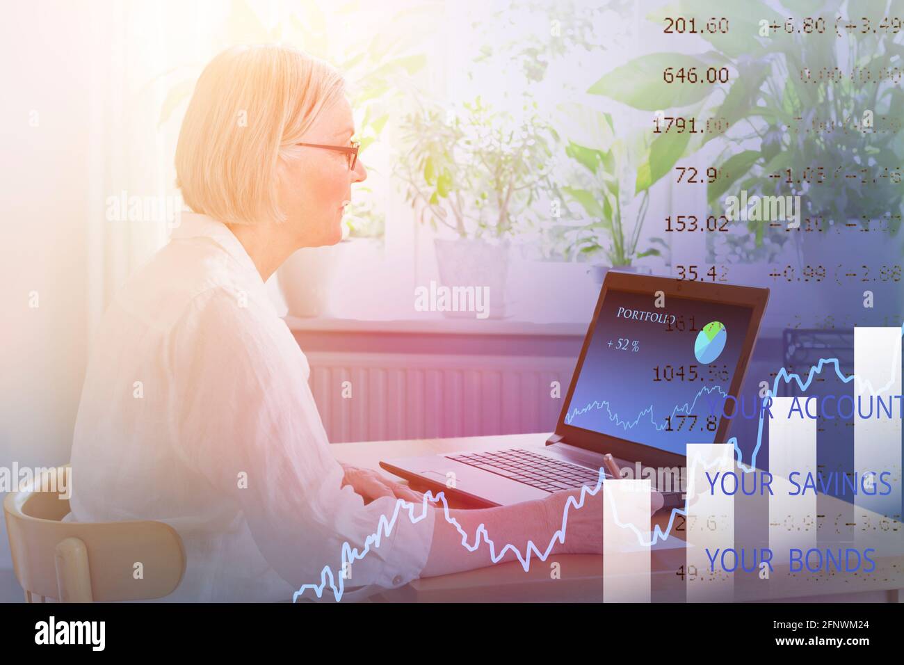 Senior woman at home checking on her investment portfolio on her laptop, online banking concept, double exposure. Stock Photo