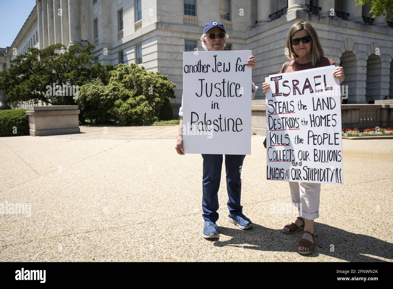 Washington, United States. 19th May, 2021. David Sperber, and Carla Fox-Sperber, hold signs in support of Palestine for their third day of protest outside of Longworth House Office Building during the ongoing conflict between Israel and Palestine in Washington, DC on Wednesday, May 19, 2021. The Sperbers traveled from Rochester, New York to protest on Capitol Hill. Photo by Sarah Silbiger/UPI Credit: UPI/Alamy Live News Stock Photo