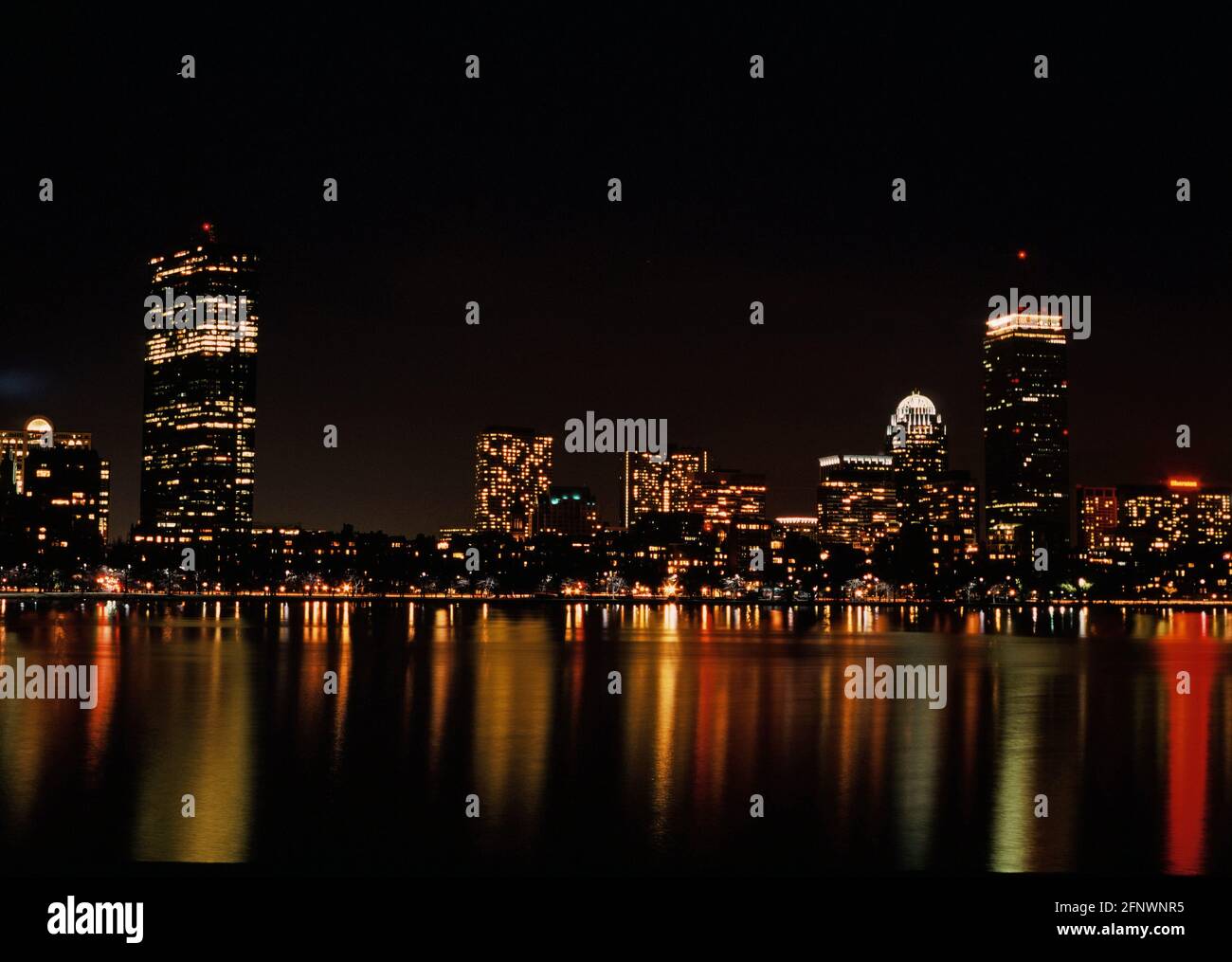 Boston skyline at night from the Charles River Stock Photo
