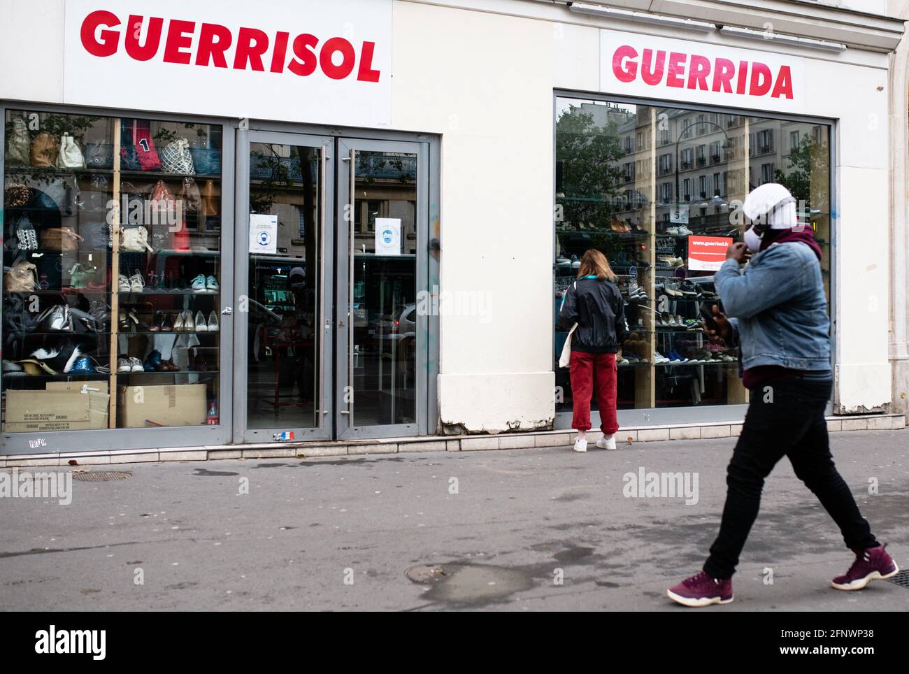 People do shopping at a Guerrisol shop as all shops reopen in Paris, on May  19, 2021. Photo by Julie SebadelhaABACAPRESS.COM Stock Photo - Alamy