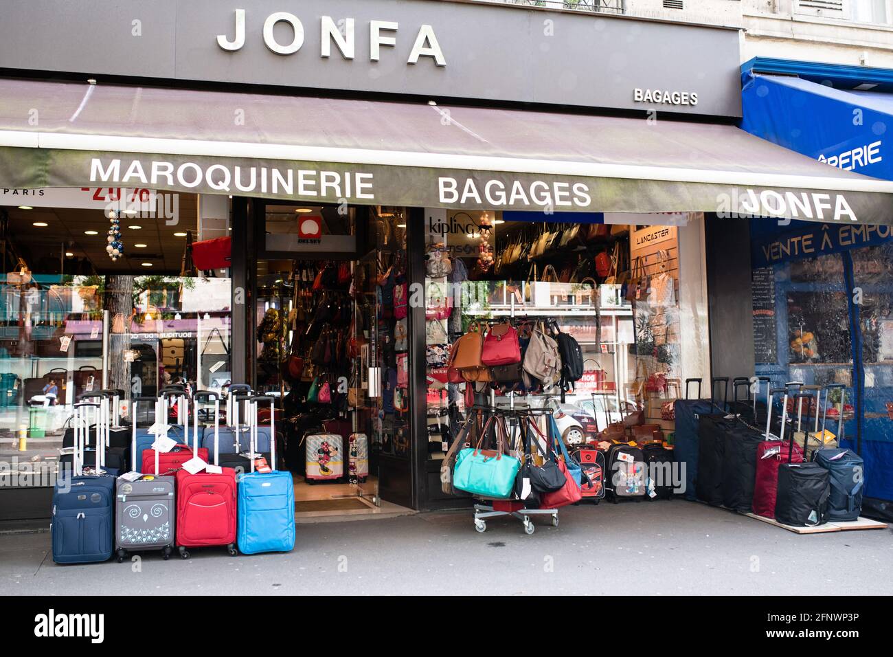 A lugggage and bag shop is pictured as all shops reopen in Paris, on May  19, 2021. Photo by Julie Sebadelha/ABACAPRESS.COM Stock Photo - Alamy