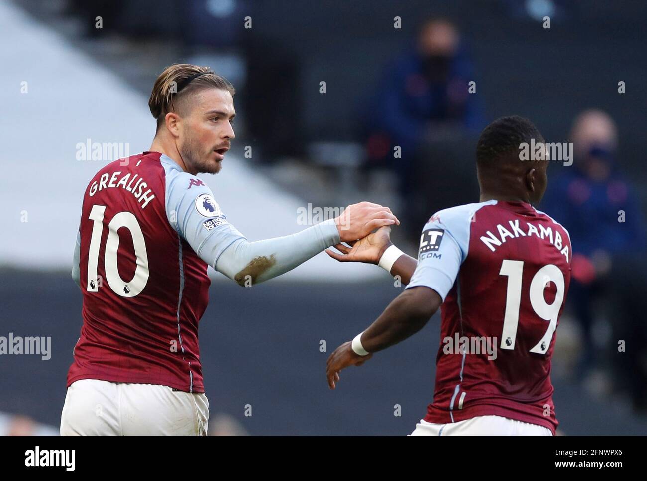 Aston Villa's Jack Grealish (left) and Marvelous Nakamba celebrate their side's first goal of the game, an own goal scored by Tottenham Hotspur's Sergio Reguilon (not pictured) during the Premier League match at the Tottenham Hotspur Stadium, London. Picture date: Wednesday May 19, 2021. Stock Photo
