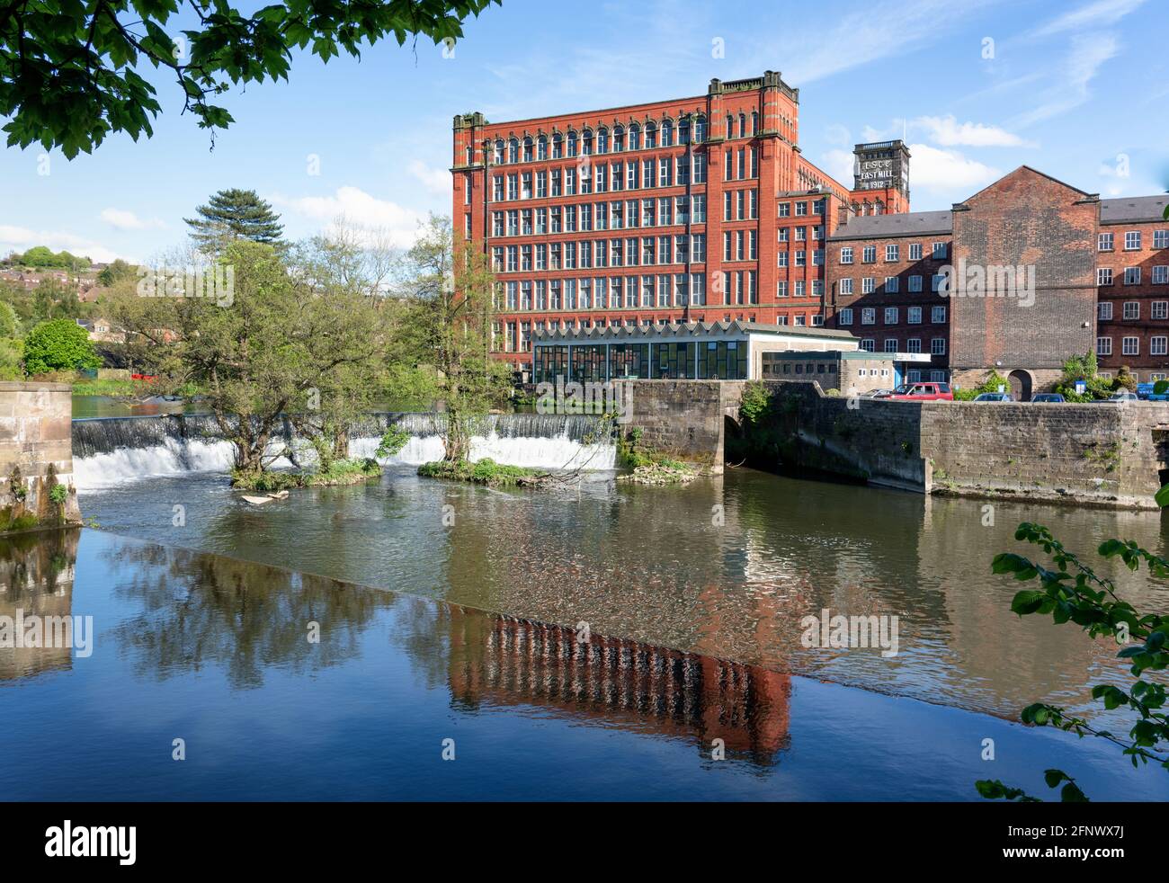Belper North Mill also known as Strutt's North Mill on the River Derwent in Derbyshire UK built as a cotton mill in the early industrial revolution Stock Photo