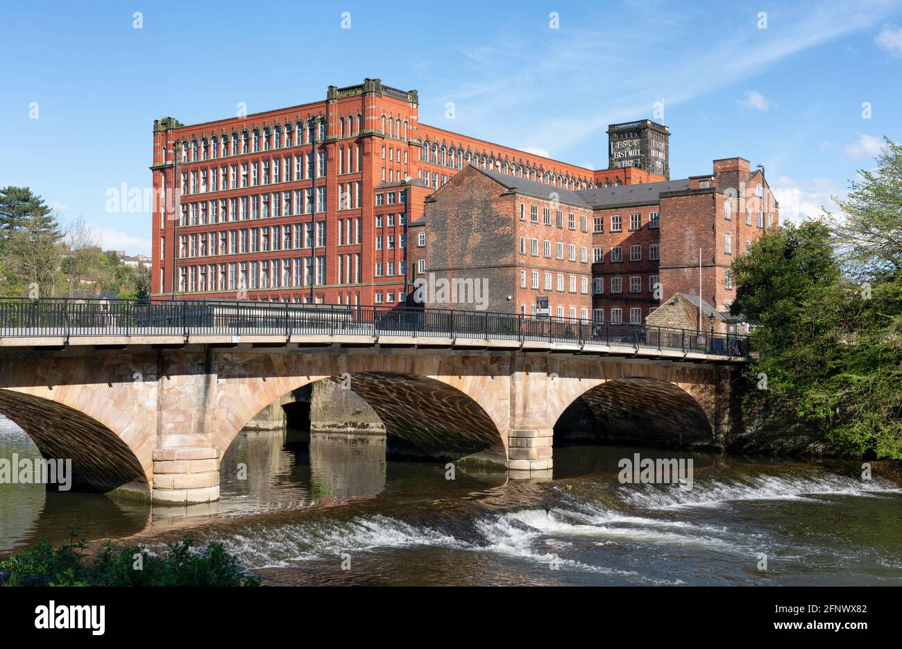 Belper North Mill also known as Strutt's North Mill on the River Derwent in Derbyshire UK built as a cotton mill in the early industrial revolution Stock Photo