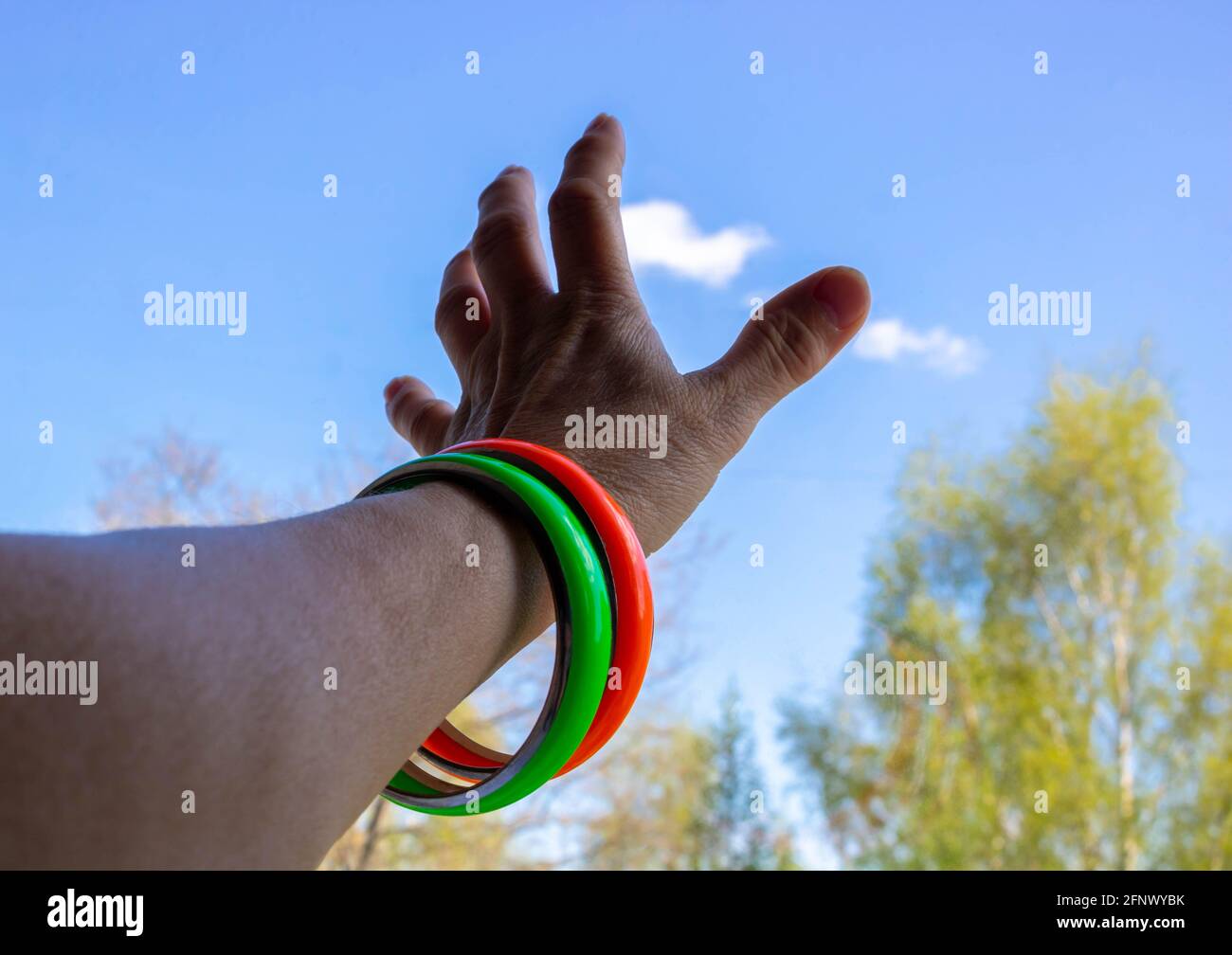 Black hand reaching to sky hi-res stock photography and images - Alamy