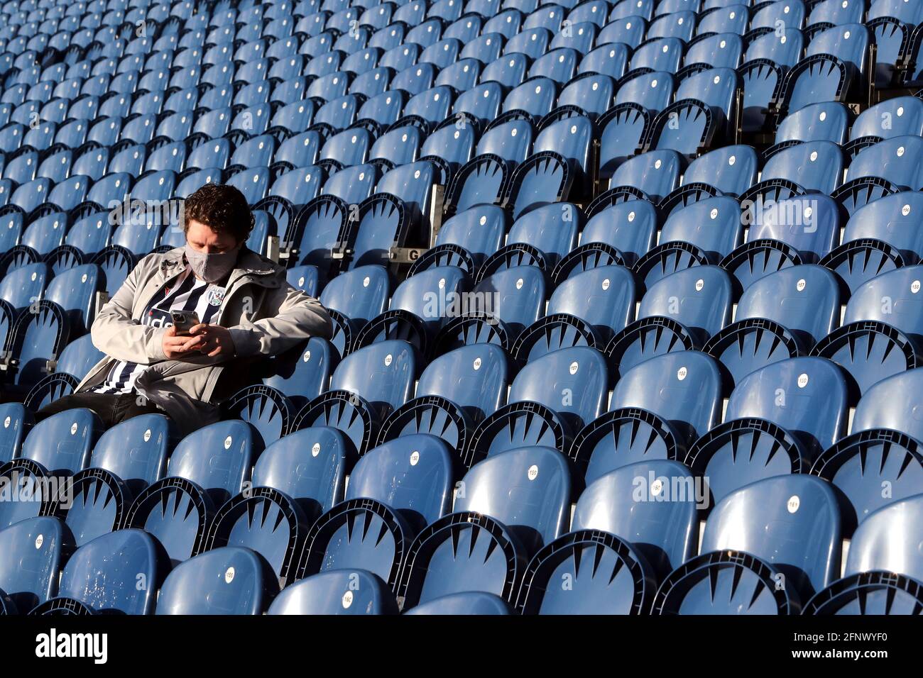 West Bromwich Albion fans in the stands prior to the Premier League match at The Hawthorns, West Bromwich. Picture date: Wednesday May 19, 2021. Stock Photo