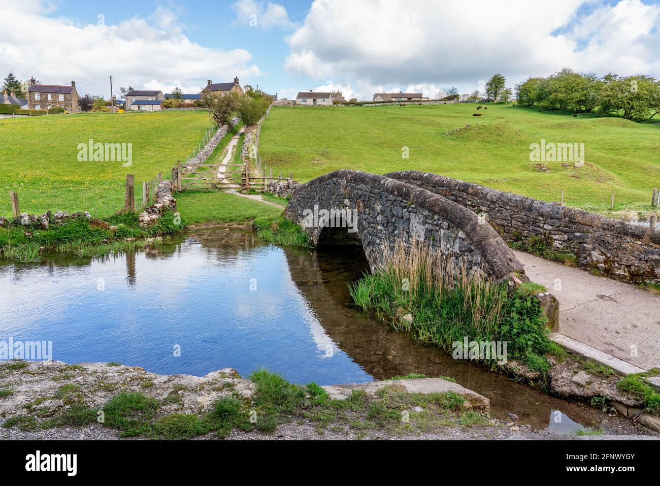 Packhorse bridge on the River Bradford below the village of Youlgreave in the Derbyshire Peak District UK Stock Photo