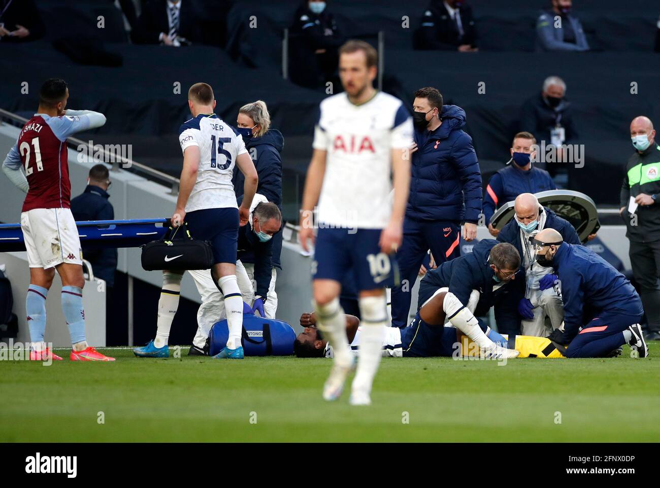 Tottenham Hotspur's Japhet Tanganga receives treatment for an injury during the Premier League match at the Tottenham Hotspur Stadium, London. Picture date: Wednesday May 19, 2021. Stock Photo