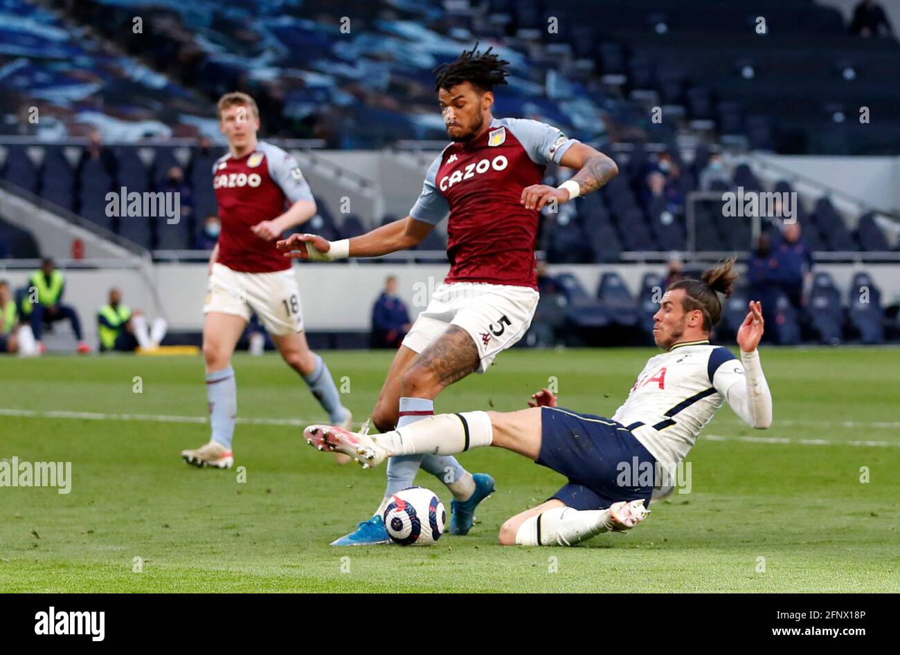 Tottenham Hotspur's Gareth Bale (right) challenges Aston Villa's Tyrone Mings during the Premier League match at the Tottenham Hotspur Stadium, London. Picture date: Wednesday May 19, 2021. Stock Photo