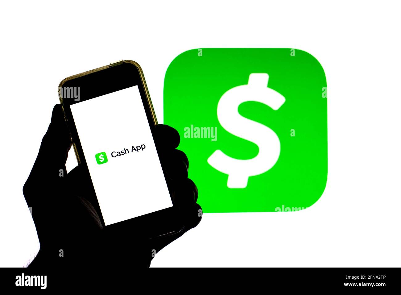 Spain. 19th May, 2021. In this photo illustration a Cash App seen displayed on a smartphone with the Cash App logo in the background. Credit: Thiago Prudencio/SOPA Images/ZUMA Wire/Alamy Live News Stock Photo
