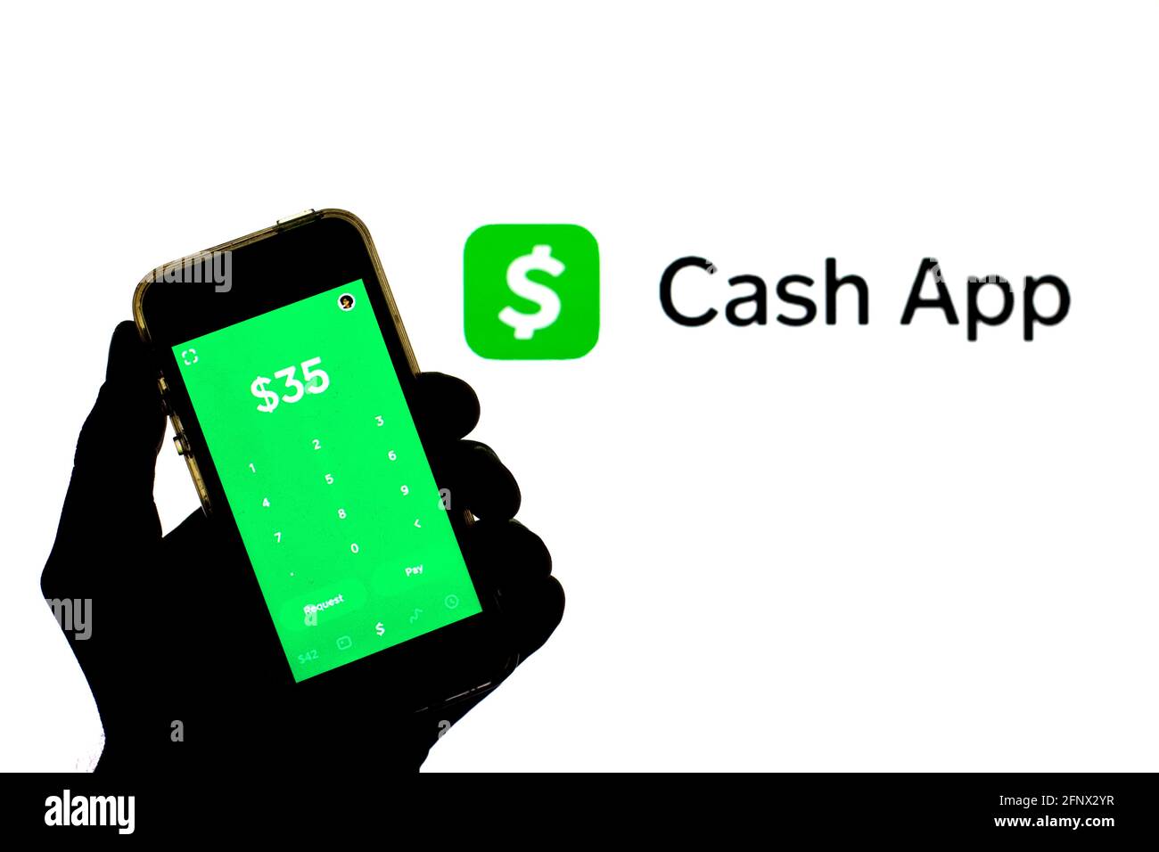 Spain. 19th May, 2021. In this photo illustration a Cash App seen displayed on a smartphone with the Cash App logo in the background. Credit: Thiago Prudencio/SOPA Images/ZUMA Wire/Alamy Live News Stock Photo