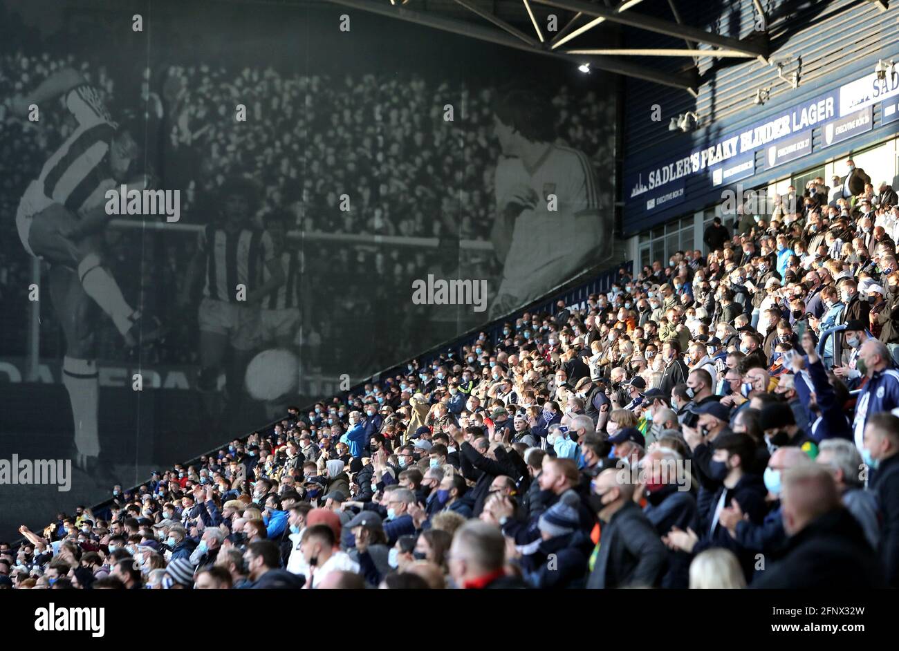 West Bromwich Albion fans applaud the players prior to kick-off during the Premier League match at The Hawthorns, West Bromwich. Picture date: Wednesday May 19, 2021. Stock Photo