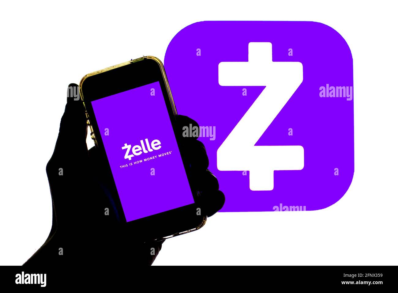 Spain. 19th May, 2021. In this photo illustration a Zelle app seen displayed on a smartphone with the Zelle logo in the background. Credit: Thiago Prudencio/SOPA Images/ZUMA Wire/Alamy Live News Stock Photo