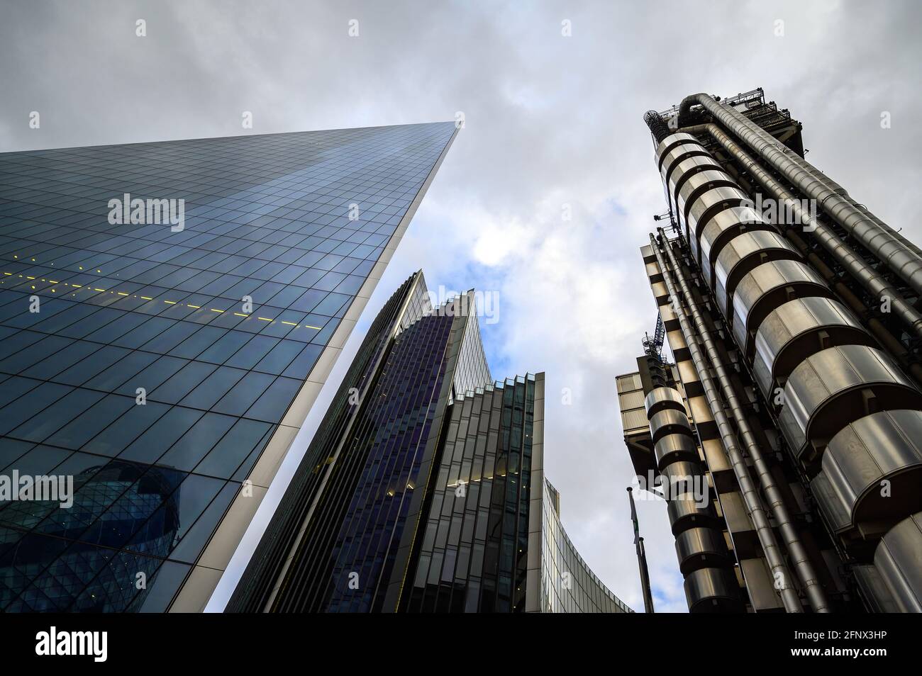 London, UK:Tall buildings in the City of London. L-R The Scalpel or 52 Lime Street, Willis Towers Watson offices and the Lloyd's of London Building. Stock Photo