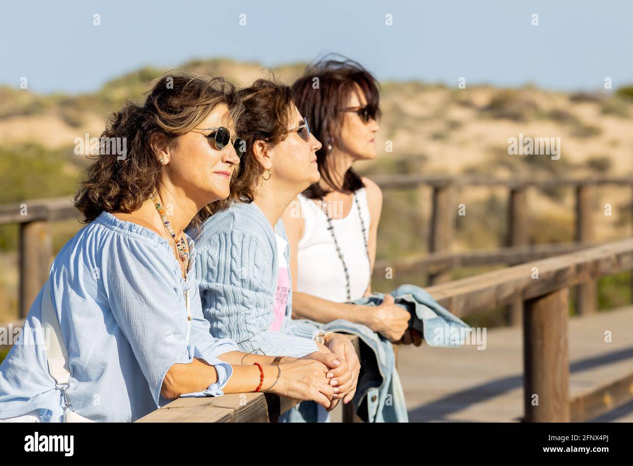 Three girls laughing hi-res stock photography and images - Alamy