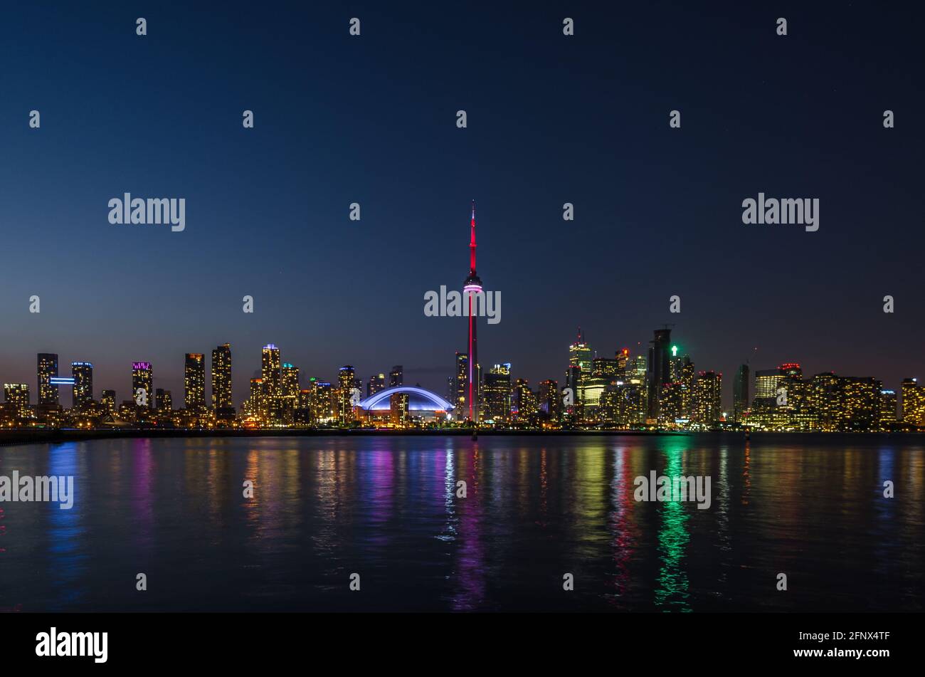 Skyline of Toronto over Ontario Lake after sunset Stock Photo - Alamy