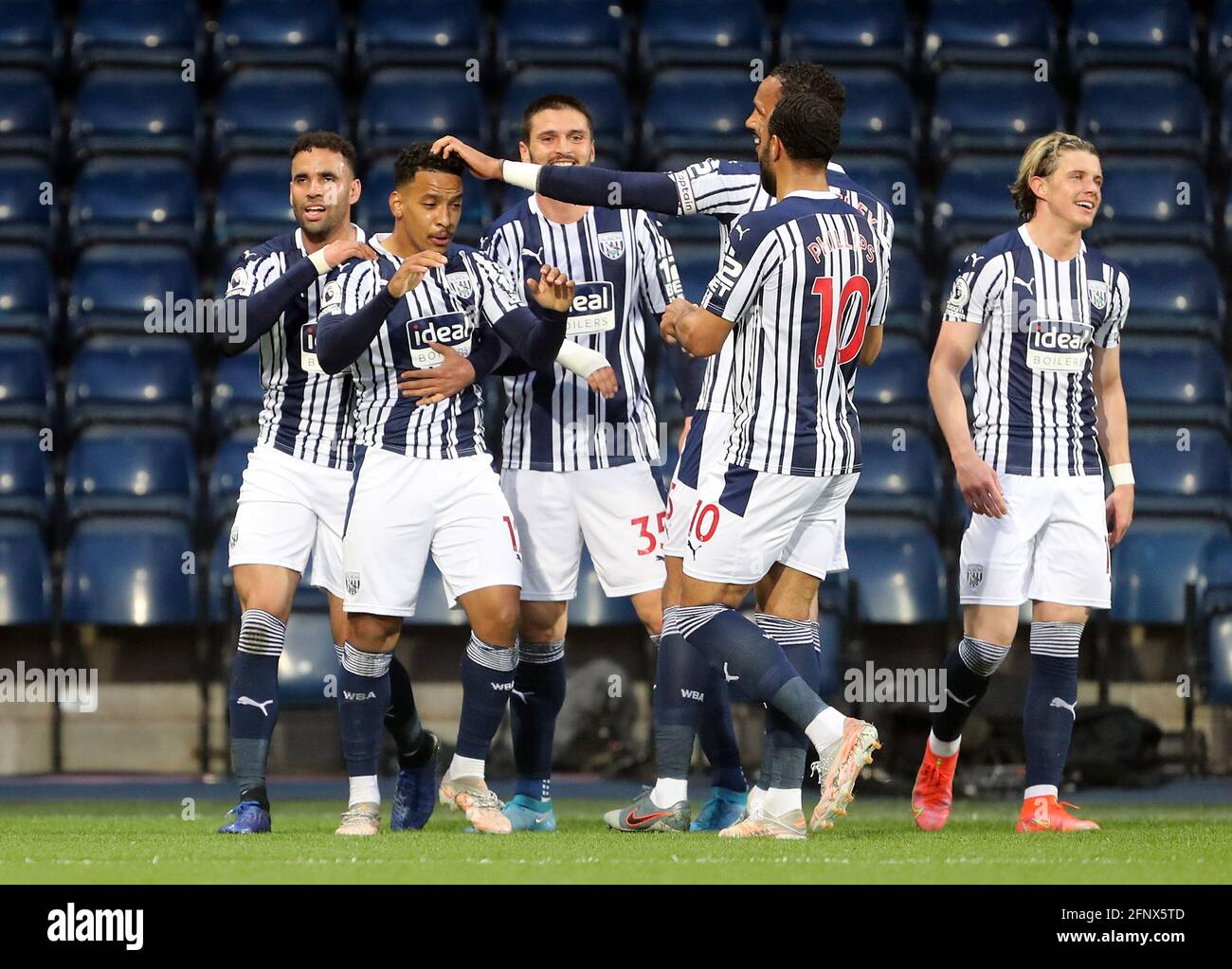 West Bromwich Albion's Matheus Pereira celebrates their side's first goal of the game, scored by West Ham United's Tomas Soucek (not pictured) during the Premier League match at The Hawthorns, West Bromwich. Picture date: Wednesday May 19, 2021. Stock Photo