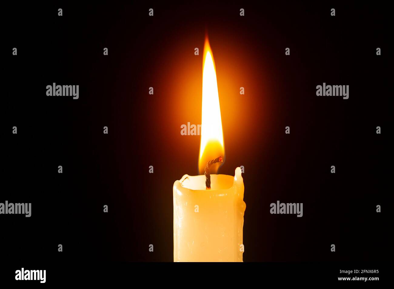 Candle burning in the dark Stock Photo Alamy