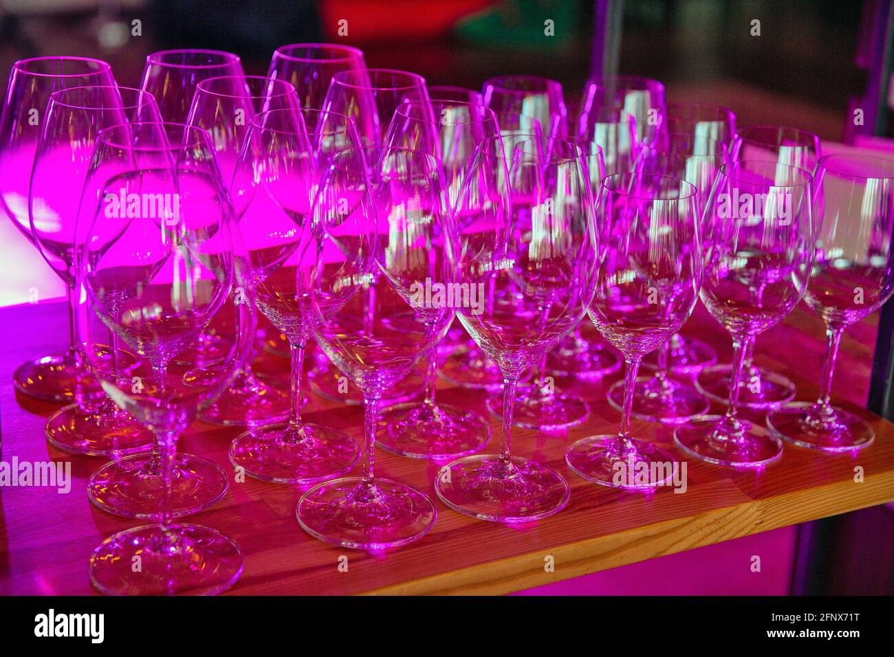 Set of empty wine glasses closeup in red light Stock Photo