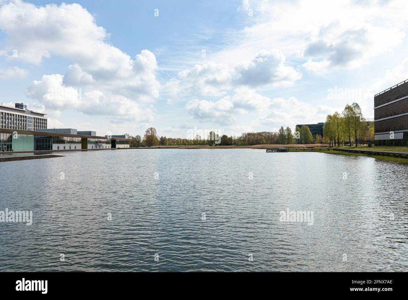 Eindhoven, The Netherlands, May 3rd 2021. High Tech Campus exterior buildings with the Philips headquarters, a lake, trees and greenery on a sunny day Stock Photo