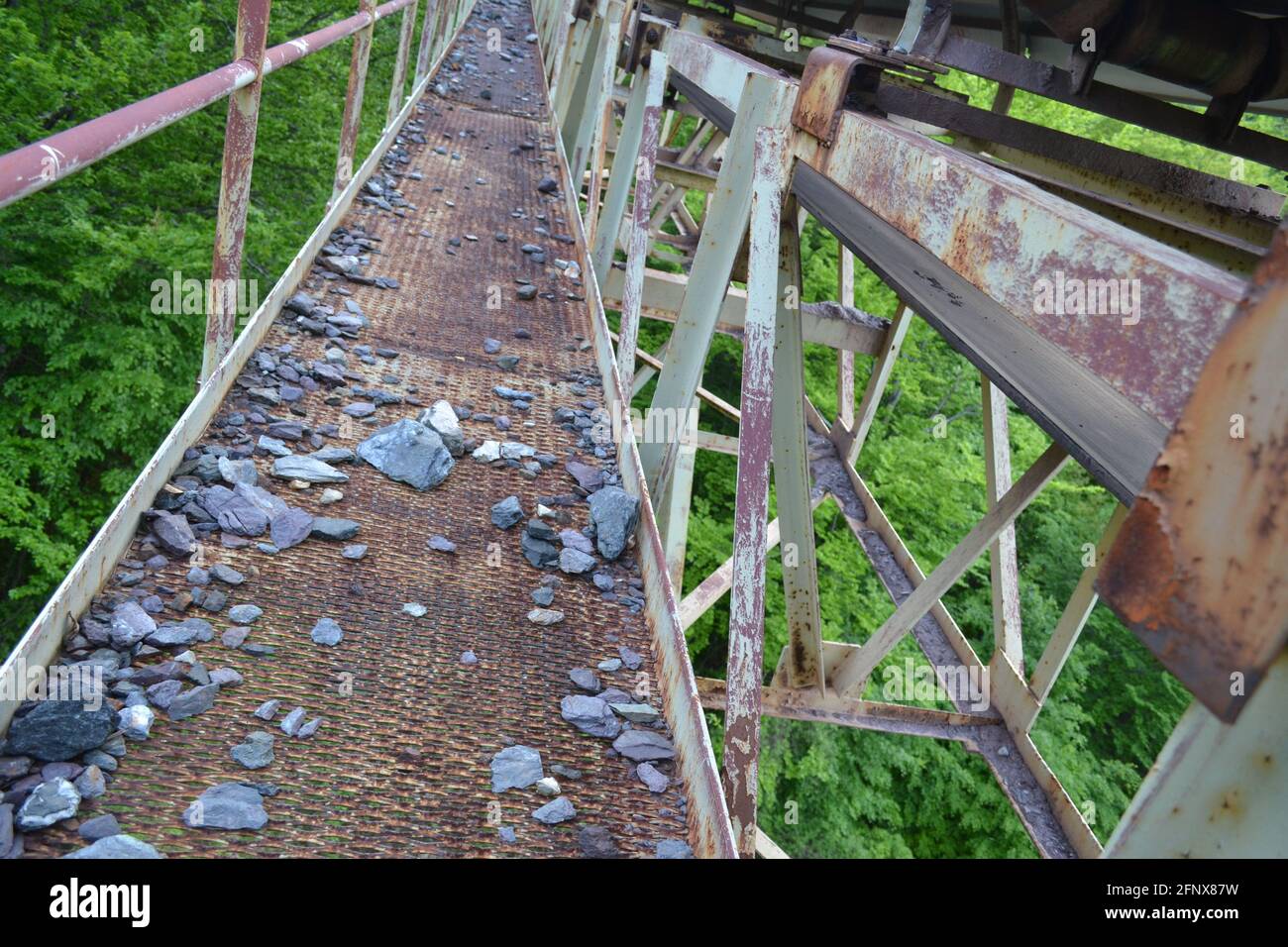 Bridge with conveyor belt transporting iron ore to the factory Stock ...