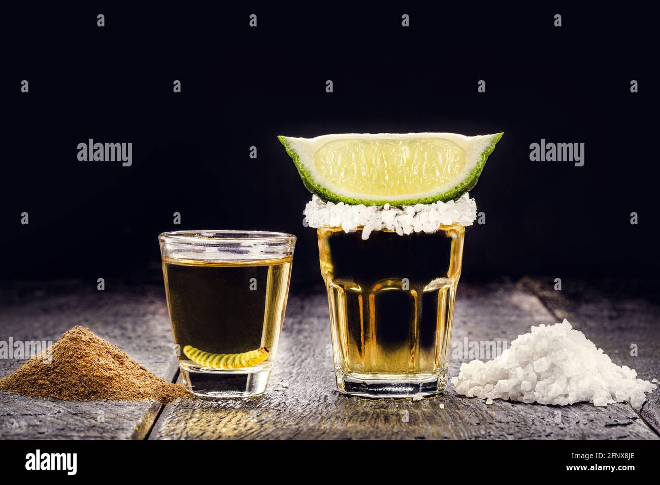typical mexican drinks, Mezcal with pepper salt and agave larva next to
