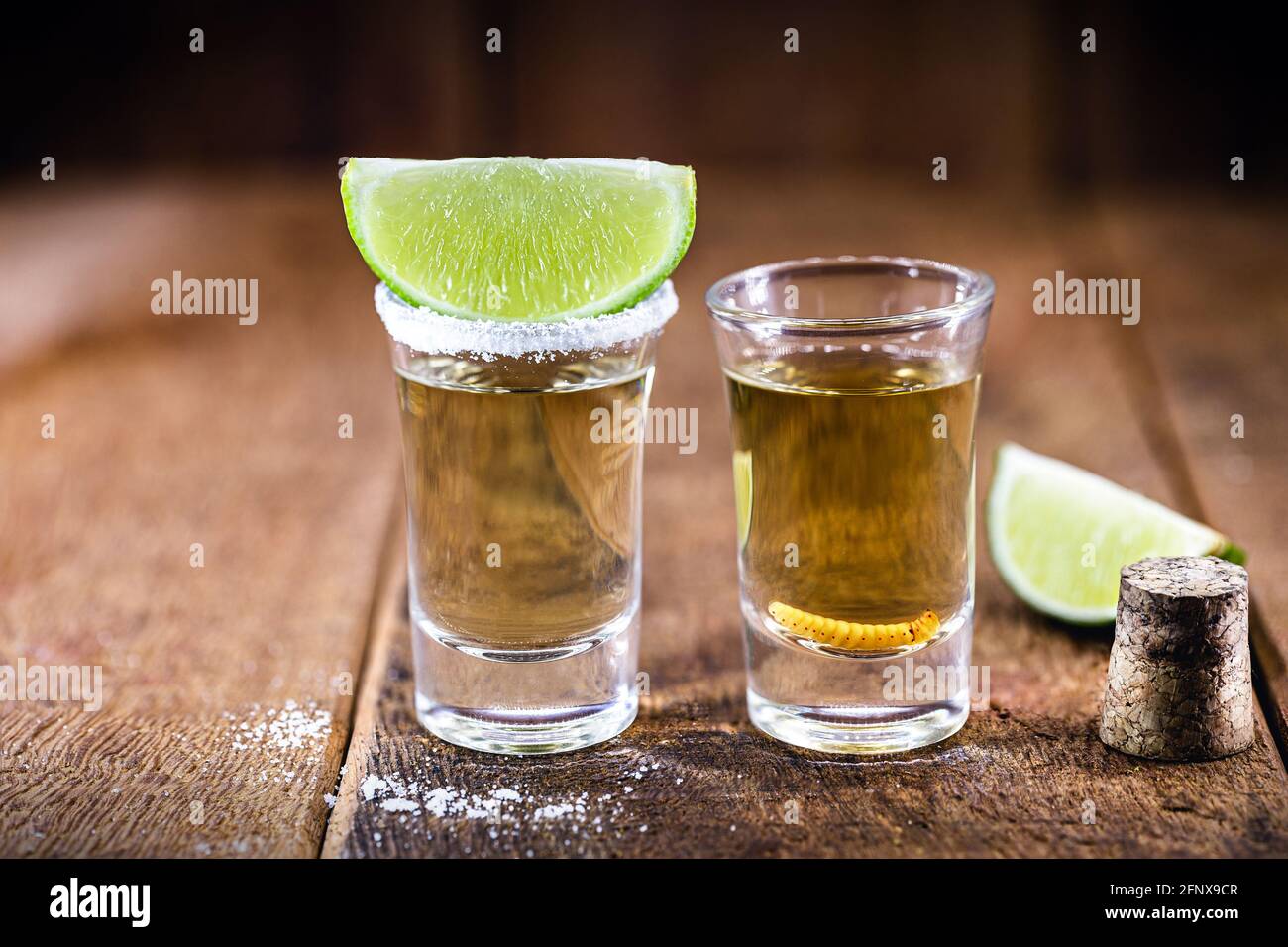 typical mexican drinks, glass with tequila served with salt and lemon