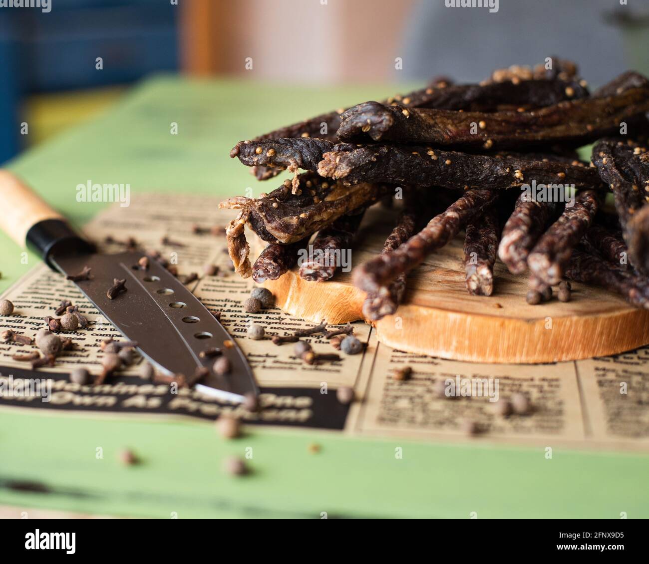 Biltong (dried meat) being cut Stock Photo Alamy