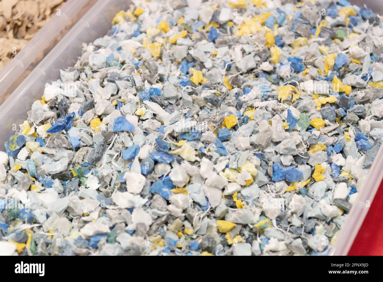 Fractions of recyclable materials after recycling. Pulverized materials before reuse in factories. Stock Photo