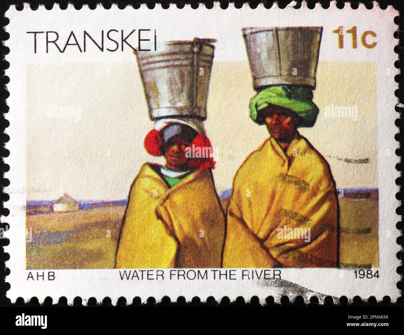African women carrying water on postage stamp Stock Photo