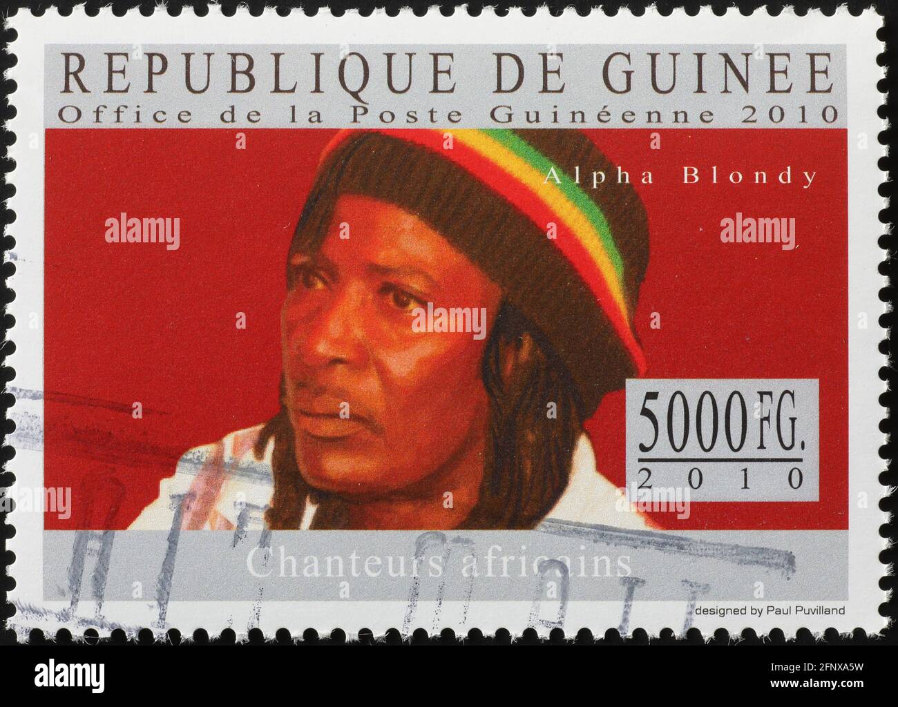 Alpha Blondy on postage stamp of Guinea Stock Photo