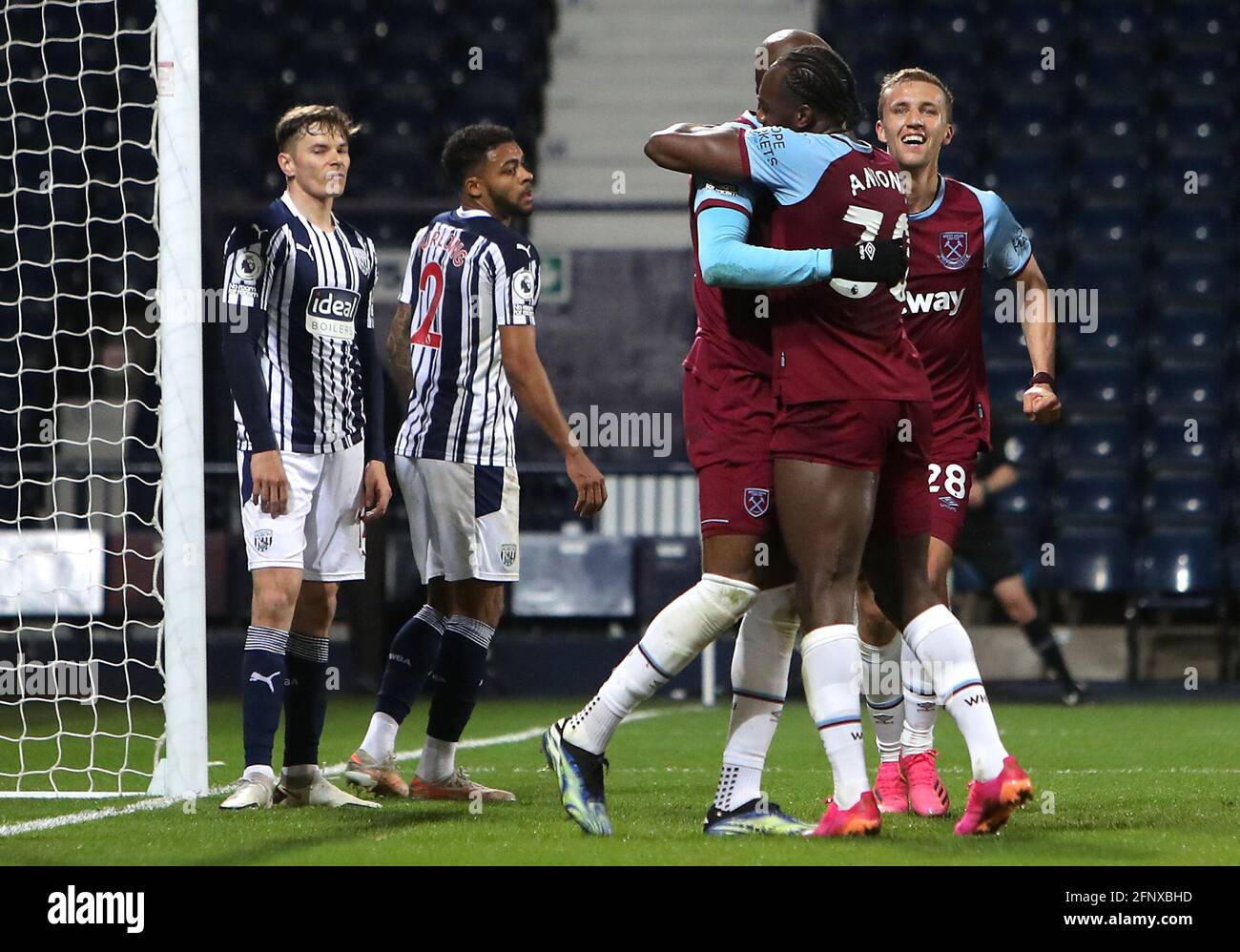 West Ham United's Angelo Ogbonna (centre) celebrates scoring their side's second goal of the game with team-mates during the Premier League match at The Hawthorns, West Bromwich. Picture date: Wednesday May 19, 2021. Stock Photo