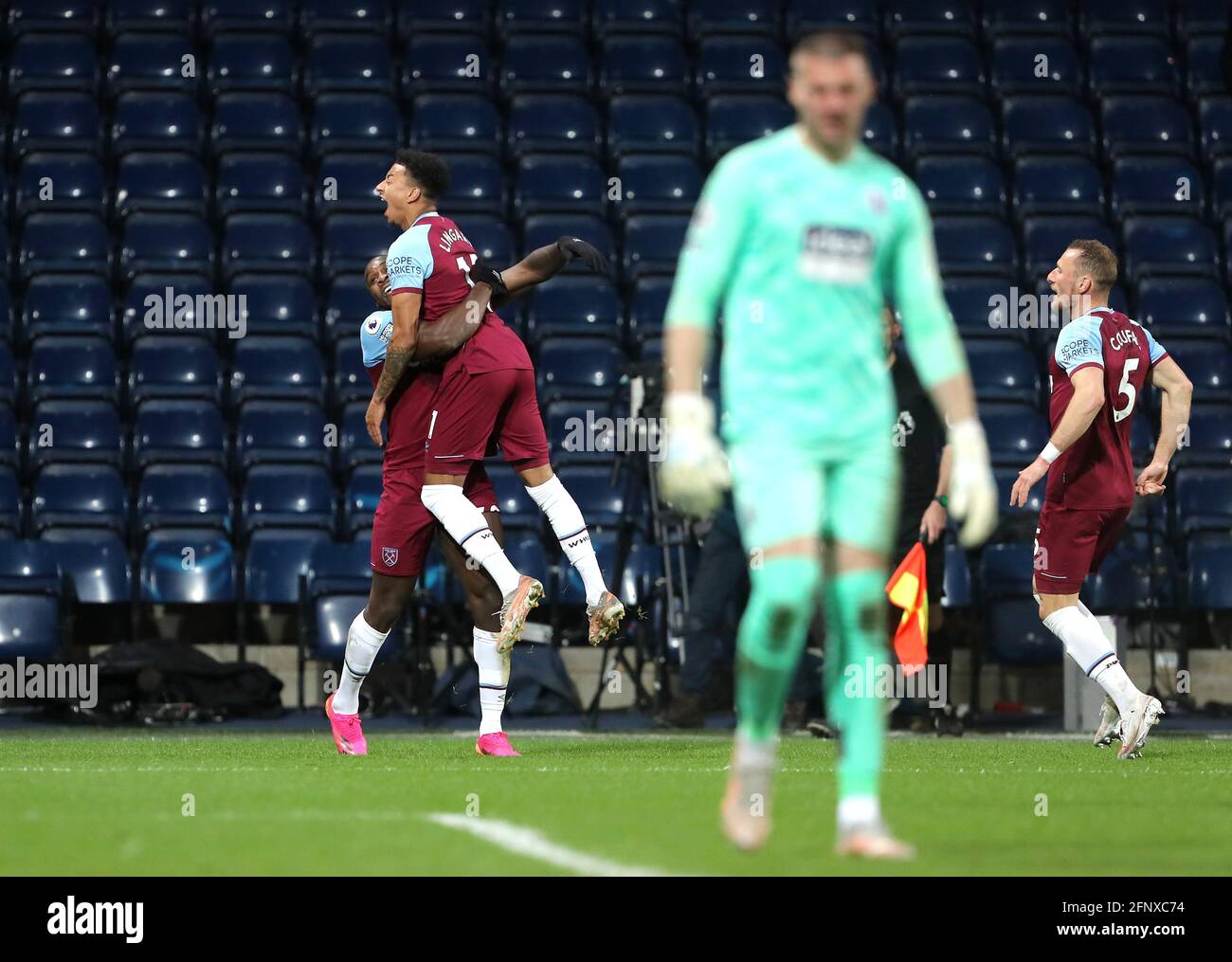 West Ham United's Michail Antonio (left) celebrates scoring their side's third goal of the game with team-mate Jesse Lingard during the Premier League match at The Hawthorns, West Bromwich. Picture date: Wednesday May 19, 2021. Stock Photo