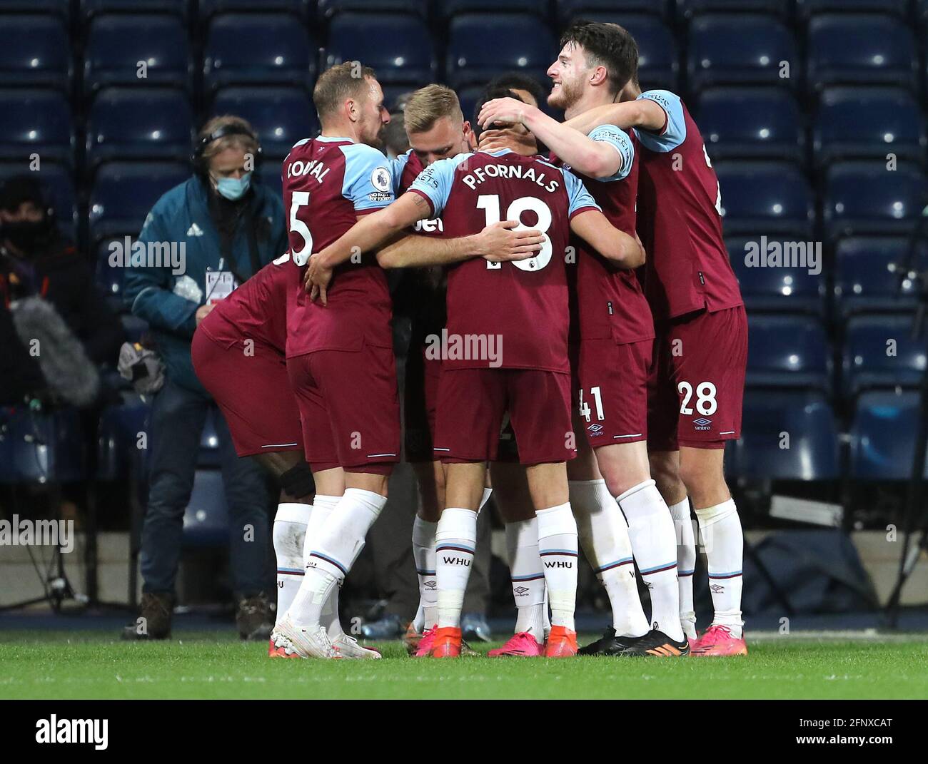 West Ham United's Michail Antonio (hidden) celebrates scoring their side's third goal of the game with team-mates during the Premier League match at The Hawthorns, West Bromwich. Picture date: Wednesday May 19, 2021. Stock Photo
