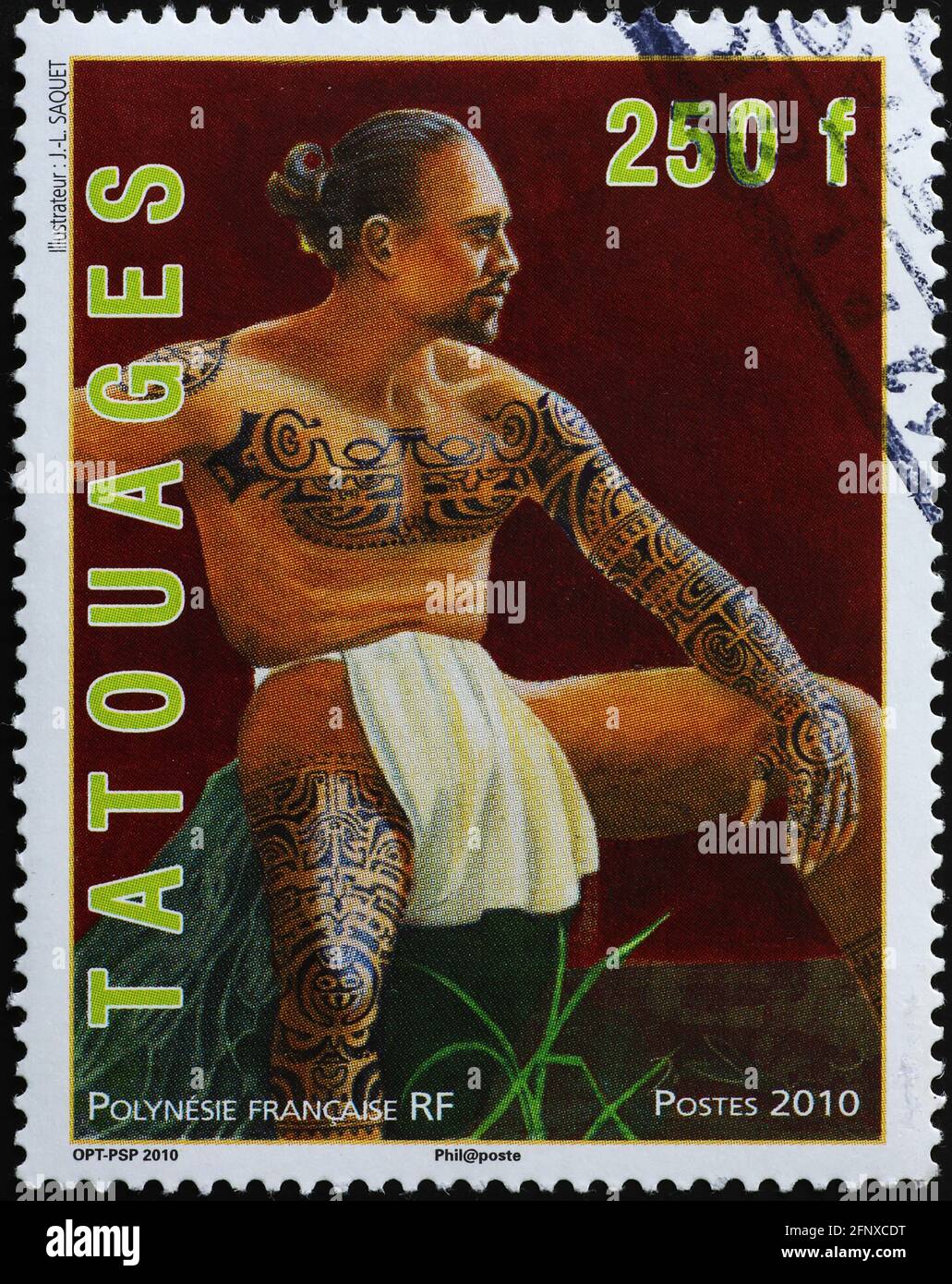 Portrait of tattoed man on polynesian postage stamp Stock Photo