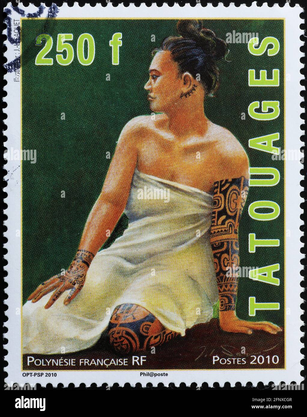 Portrait of tattoed woman on polynesian postage stamp Stock Photo
